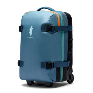Cotopaxi Allpa 38L roller bag in blue spruce, carry-on luggage with wheels and handle, designed for travel and easy portability.