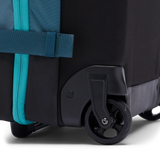 Cotopaxi 65L roller checked luggage bag with sturdy wheels and handle, designed for travel and easy maneuvering.