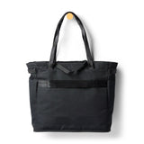 Cotopaxi Mente 22L tote bag in black with adjustable straps and spacious main compartment, made of durable fabric.