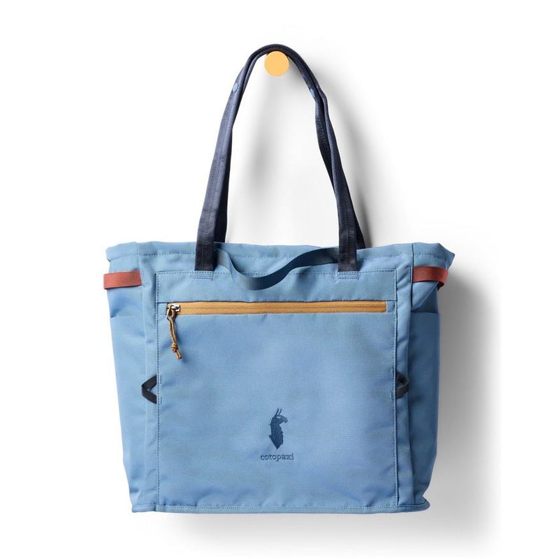 Cotopaxi Mente 22L tote bag in Fjord with adjustable straps and spacious main compartment, made of durable, eco-friendly fabric.