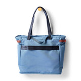 Cotopaxi Mente 22L Tote bag in Fjord color, showing its spacious fabric with sturdy handles and minimalist design.