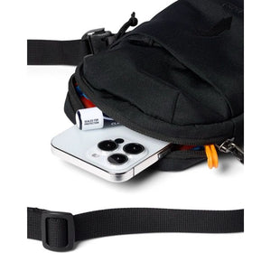 Cotopaxi Todo 1L shoulder bag in black with adjustable strap and compact design, ideal for carrying small essentials.