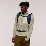Cotopaxi Elqui 24L backpack in vibrant kale green with multiple compartments and adjustable straps, ideal for daily use and travel.