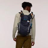 Cotopaxi Elqui 24L backpack with colorful kale pattern, adjustable straps, and multiple compartments for outdoor and daily use.