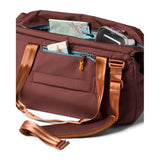 Cotopaxi Viaje 35L travel duffel bag in sepia with durable fabric and adjustable shoulder strap on a plain background.