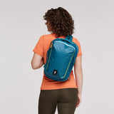 Cotopaxi Chasqui 13L Sling pack in vibrant colors, compact design with adjustable strap for daily use and outdoor activities.
