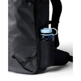 Cotopaxi Allpa 35L travel backpack in black with multiple compartments and padded straps for comfortable travel.