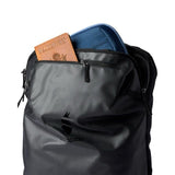 Cotopaxi Allpa 35L travel backpack in black, featuring multiple compartments and adjustable straps for versatile travel use.