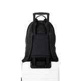 Dagne Dover Dakota Neoprene Backpack in Onyx, medium size, with top handle and adjustable shoulder straps, on a white background.