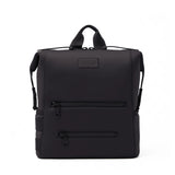 Dagne Dover Indi Neoprene Diaper Backpack in Onyx black, large size, front view showing sleek design and spacious compartments
