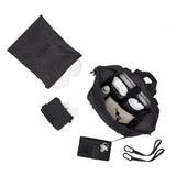 Dagne Dover Indi Neoprene Diaper Backpack in Onyx black, large size, with top-down view showing sleek design and spacious compartments.