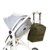 Dagne Dover Indi Neoprene Diaper Backpack in Dark Moss, medium size, with multiple compartments and stroller straps for parents.