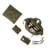 Dagne Dover Indi Neoprene Diaper Backpack in dark moss color, medium size with top-down view showing sleek design and sturdy handles.