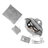 Dagne Dover Indi Neoprene Diaper Backpack in Heather Grey, medium size, with top-down view showing sleek design and multiple compartments.