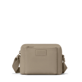 Dagne Dover Micah Neoprene Crossbody bag in khaki with front zipper pocket and adjustable strap, showcasing its sleek, casual design.