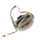 Khaki Dagne Dover Micah Neoprene Crossbody bag with adjustable strap and sleek design, ideal for everyday use.