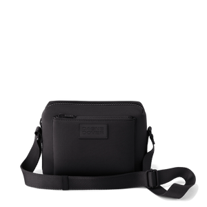 Black Dagne Dover Micah neoprene crossbody bag with adjustable strap and sleek design, ideal for everyday use