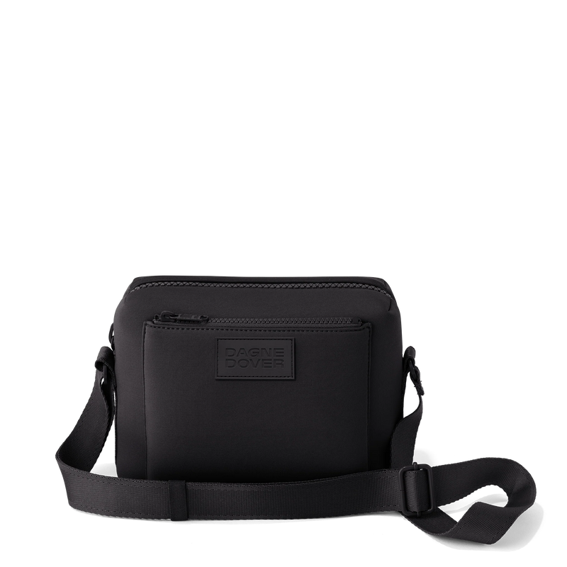 Black Dagne Dover Micah neoprene crossbody bag with adjustable strap and sleek design, ideal for everyday use