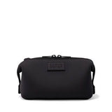 Small Dagne Dover Hunter Toiletry Bag in dark moss with multiple compartments and a sleek, compact design for travel organization.
