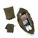 Dagne Dover Landon Neoprene Carryall Bag in dark moss, extra large duffel bag with top-down view and durable neoprene material