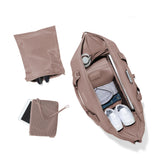 Dagne Dover Landon Neoprene Carryall Bag in Dune color, large duffel bag with top view, soft neoprene material and spacious design