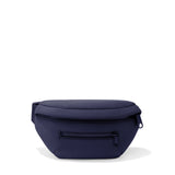 Dagne Dover Ace Neoprene Fanny Pack in dune color, with adjustable strap and zippered compartment for convenient carrying.