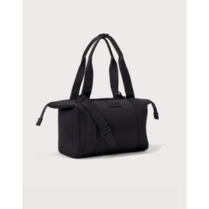 Medium Dagne Dover Landon Carryall bag with sleek design, showing its spacious interior and stylish exterior in a modern setting.