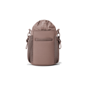 Dagne Dover Sloan water bottle sling in Dune color, compact and stylish, designed to hold a water bottle securely.