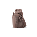 Dagne Dover Sloan Water Bottle Sling in Dune color, compact side view showing adjustable strap and sleek design.