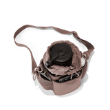 Dagne Dover Sloan Water Bottle Sling in Dune, top-down view showcasing the sleek, compact design for carrying water bottles.