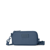 Dagne Dover Mara Phone Sling made of navy neoprene, featuring a compact design with a front pocket and adjustable strap.