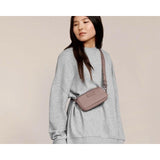 Dagne Dover Mara phone sling bag in black with adjustable strap, designed for carrying a phone and small essentials.