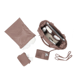 Dagne Dover Wade diaper tote bag in Dune color, featuring multiple compartments and sturdy handles for organized baby essentials.