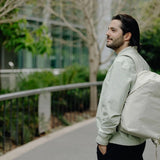 Peak Design City Backpack 15L shown in black with padded shoulder straps and multiple compartments for daily urban use.