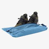 Eagle Creek Pack-It Reveal Shoe Sack showing a clear, lightweight shoe organizer with a zipper closure and compact design.
