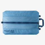 Eagle Creek Pack-It Reveal Shoe Sack with transparent design and zipper closure, holding a pair of shoes for travel organization.