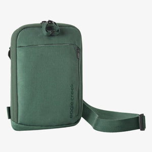Black Eagle Creek Stash RFID Crossbody Bag with adjustable strap and multiple compartments for travel essentials.