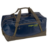Eagle Creek Migrate Duffel 90L in black, showing durable fabric with carry handles and spacious main compartment for travel gear.