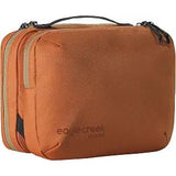 Eagle Creek Pack-It Reveal Tri-Fold Toiletry Kit in orange with multiple compartments for travel organization
