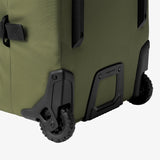 Olive green Eagle Creek ORV 30-inch 115L trunk with sturdy wheels and handle, designed for durable travel and storage.