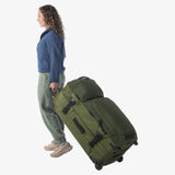 Olive green Eagle Creek ORV 30-inch travel trunk with sturdy handles and spacious 115L capacity for durable travel storage.