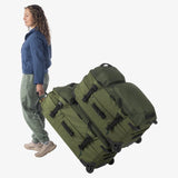 Olive green Eagle Creek ORV 30-inch 115L trunk with sturdy handles and reinforced corners for durable travel storage.