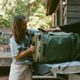 Olive green Eagle Creek ORV 30-inch 115L rolling trunk with sturdy handle and wheels, designed for durable travel storage.