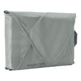 Eagle Creek PACK-IT™ Reveal Garment Folder L for packing organization, neatly folded clothes inside a clear folder.
