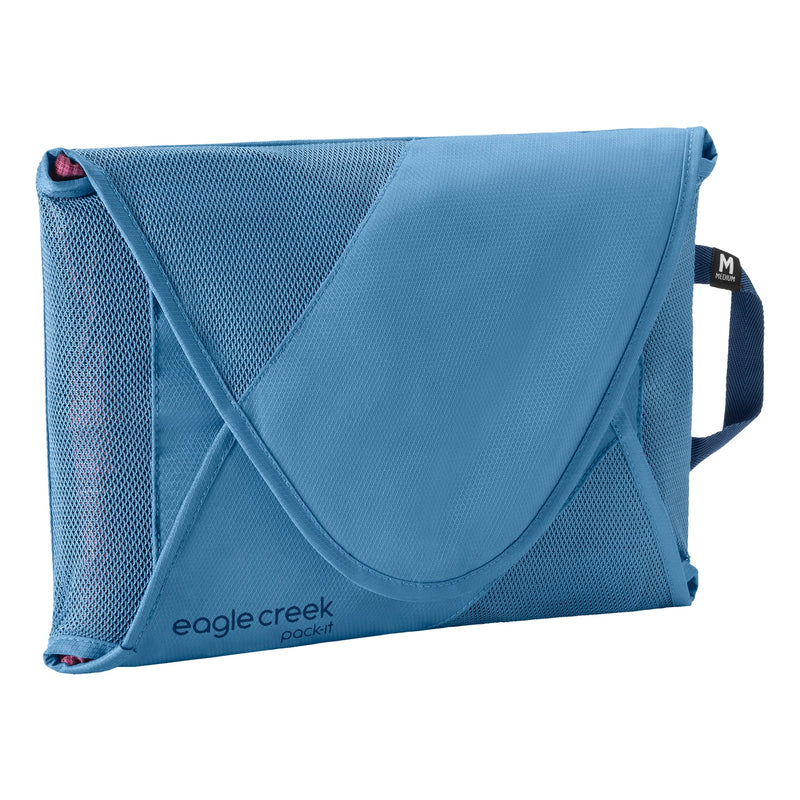Eagle Creek PACK-IT™ Reveal Garment Folder M for packing organization, showing neatly folded clothes inside transparent folder.