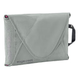 Eagle Creek PACK-IT™ Reveal Garment Folder M packing organizer with neatly folded clothing inside, ideal for travel organization.