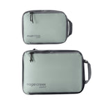 Eagle Creek PACK-IT™ Isolate Compression Cube Set S/M for packing organization, shown with folded clothing inside each cube.