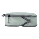 Eagle Creek PACK-IT Isolate Compression Cube Set in small and medium sizes, used for organizing and compressing clothing in luggage.