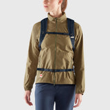 Fjallraven High Coast Foldsack 24 backpack shown in black with adjustable shoulder straps and front zip pocket.