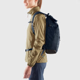 Fjallraven High Coast Foldsack 24 backpack in black, showing the sleek design and adjustable shoulder straps.